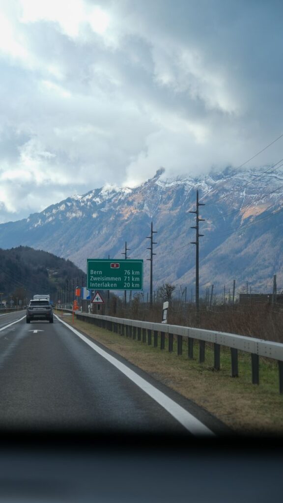 pexels-photo-31369869-31369869 Snow-capped mountains visible from a highway in Switzerland, capturing a serene drive.
